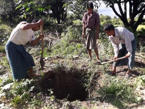 汚水槽のための穴を掘る村人